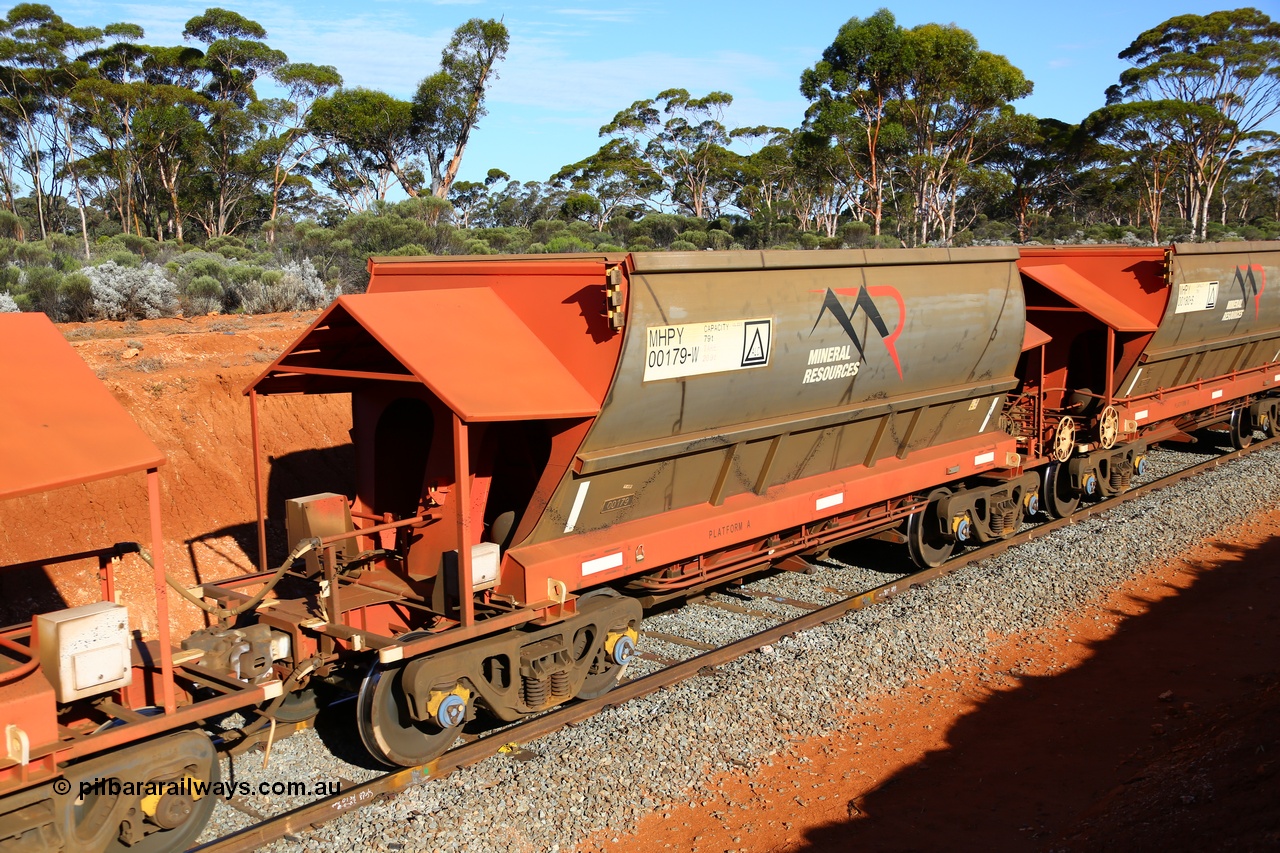190109 1673
Binduli, Mineral Resources Ltd empty iron ore train 4030 with MRL's MHPY type iron ore waggon MHPY 00180 built by CSR Yangtze Co China serial 2014/382-180 in 2014 as a batch of 382 units, these bottom discharge hopper waggons are operated in 'married' pairs.
Keywords: MHPY-type;MHPY00179;2014/382-179;CSR-Yangtze-Co-China;