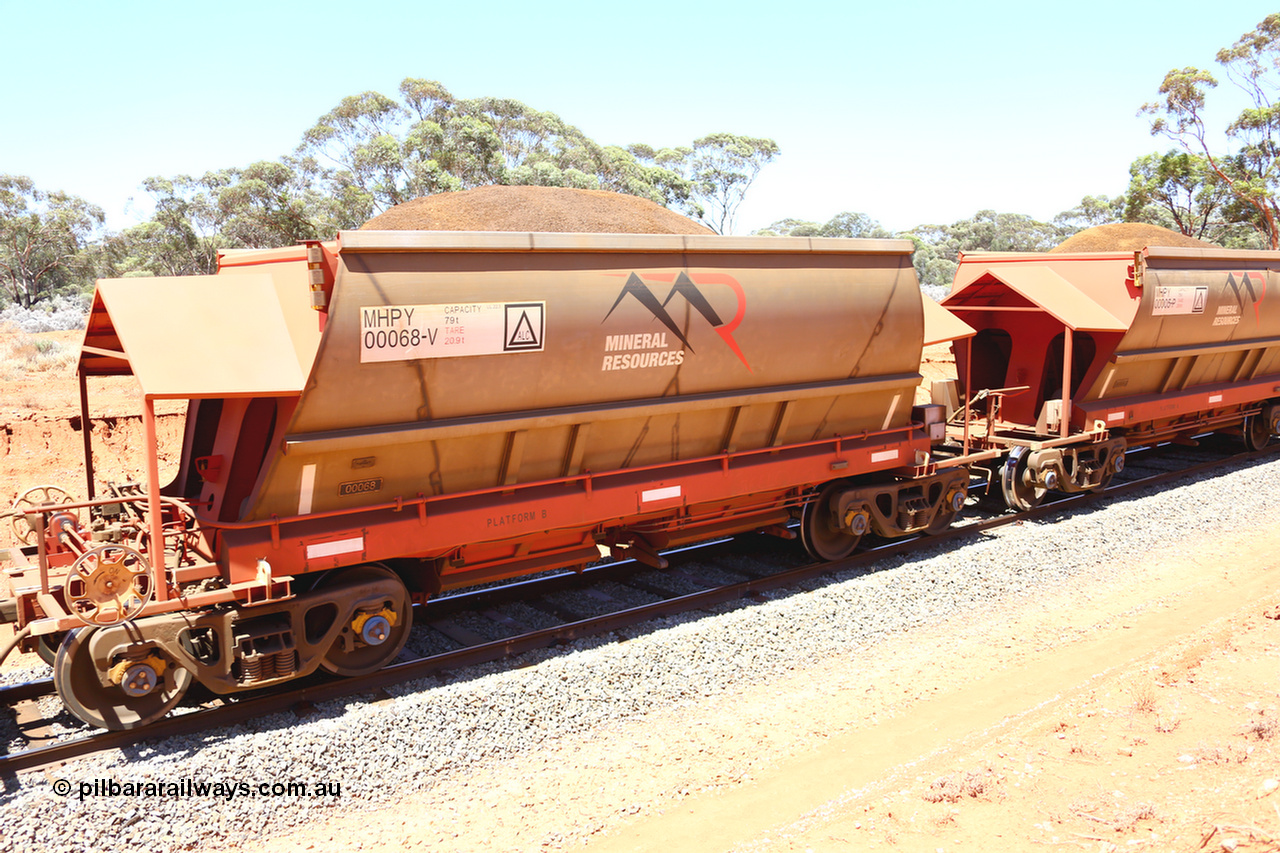 190129 4242
Binduli, on Mineral Resources Ltd loaded iron ore train service from Koolyanobbing to Esperance #3033 with MRL's MHPY type iron ore waggon MHPY 00068 built by CSR Yangtze Co China serial 2014/382-68 in 2014 as a batch of 382 units, these bottom discharge hopper waggons are operated in 'married' pairs.
Keywords: MHPY-type;MHPY00068;2014/382-68;CSR-Yangtze-Co-China;