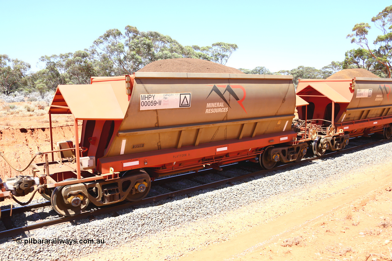 190129 4251
Binduli, on Mineral Resources Ltd loaded iron ore train service from Koolyanobbing to Esperance #3033 with MRL's MHPY type iron ore waggon MHPY 00059 built by CSR Yangtze Co China serial 2014/382-59 in 2014 as a batch of 382 units, these bottom discharge hopper waggons are operated in 'married' pairs.
Keywords: MHPY-type;MHPY00059;2014/382-59;CSR-Yangtze-Co-China;