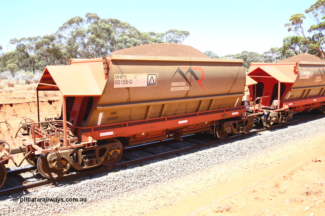 190129 4276
Binduli, on Mineral Resources Ltd loaded iron ore train service from Koolyanobbing to Esperance #3033 with MRL's MHPY type iron ore waggon MHPY 00159 built by CSR Yangtze Co China serial 2014/382-159 in 2014 as a batch of 382 units, these bottom discharge hopper waggons are operated in 'married' pairs.
Keywords: MHPY-type;MHPY00159;2014/382-159;CSR-Yangtze-Co-China;