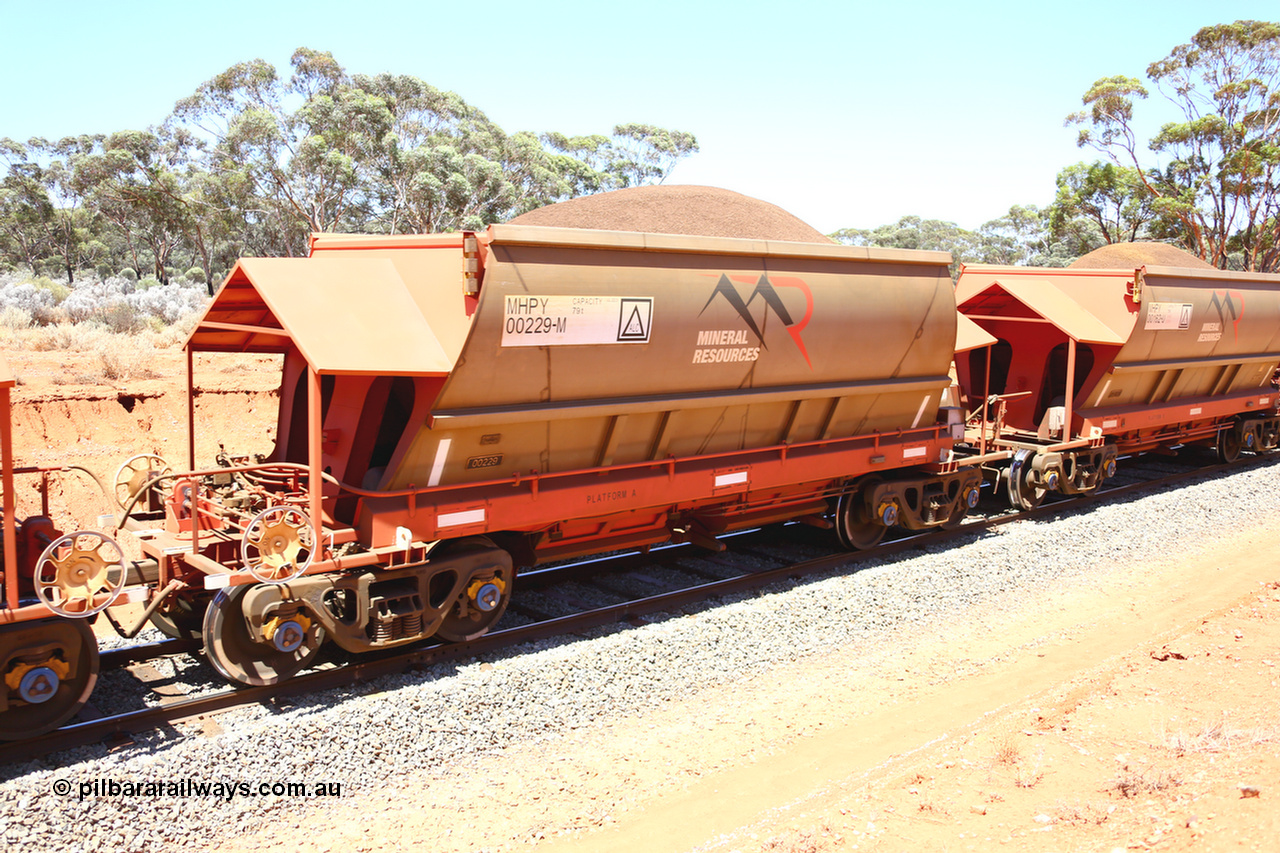 190129 4340
Binduli, on Mineral Resources Ltd loaded iron ore train service from Koolyanobbing to Esperance #3033 with MRL's MHPY type iron ore waggon MHPY 00229 built by CSR Yangtze Co China serial 2014/382-229 in 2014 as a batch of 382 units, these bottom discharge hopper waggons are operated in 'married' pairs.
Keywords: MHPY-type;MHPY00229;2014/382-229;CSR-Yangtze-Co-China;