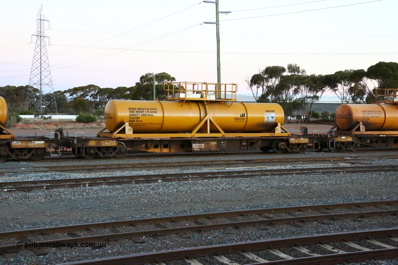 160523 3614
West Kalgoorlie, AQHY 30031 with sulphuric acid tank CSA 0107, originally built by WAGR Midland Workshops in 1964/66 as a WF type flat waggon, then in 1997, following several recodes and modifications, was one of seventy five waggons converted to the WQH type to carry CSA sulphuric acid tanks between Hampton/Kalgoorlie and Perth/Kwinana, part of loaded acid train 2406 arriving back in the yard. CSA 0107 was built by Vcare Engineering, India for Access Petrotec & Mining Solutions in 2015.
Keywords: AQHY-type;AQHY30031;WAGR-Midland-WS;WF-type;WFW-type;WFDY-type;WFDF-type;RFDF-type;WQH-type;