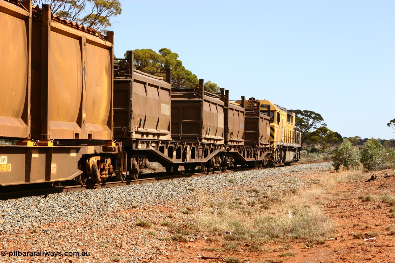060117 2712
Bardoc, Q 317 leads the loaded Malcolm freighter train 2029, AQCY type container waggon with nickel residue container COR 5727. The AQCY type waggons were built by WAGR Midland Workshops as WFX class between 1969 and 1974.
Keywords: AQCY-type;WAGR-Midland-WS;WFX-type;WQCX-type;