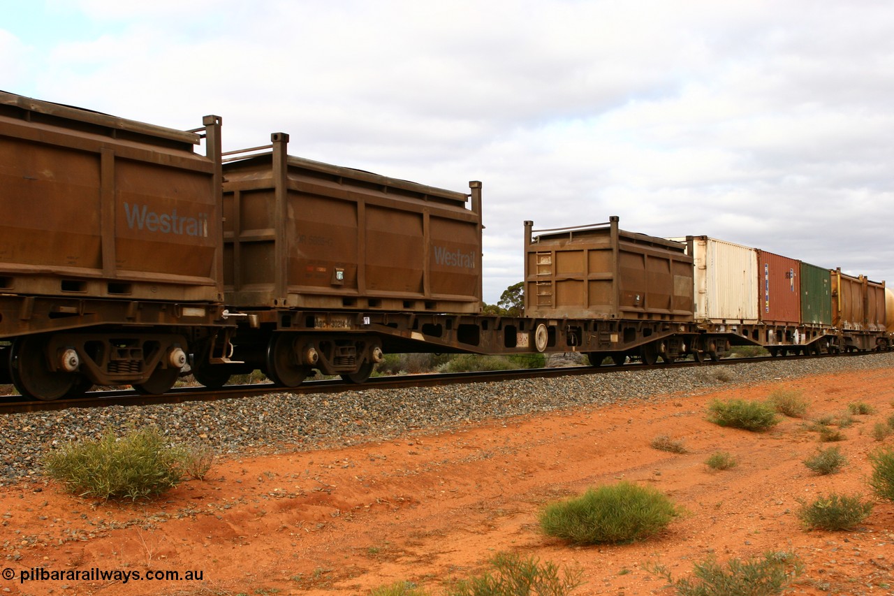 060527 4097
Scotia, AQCY 30214 container waggon, originally one of forty five built by WAGR Midland Workshops in 1974 as WFX type, to WQCX in 1980. Carrying two COR type nickel residue containers with modified tops, COR 5885 and another.
Keywords: AQCY-type;AQCY30214;WAGR-Midland-WS;WFX-type;WQCX-type;