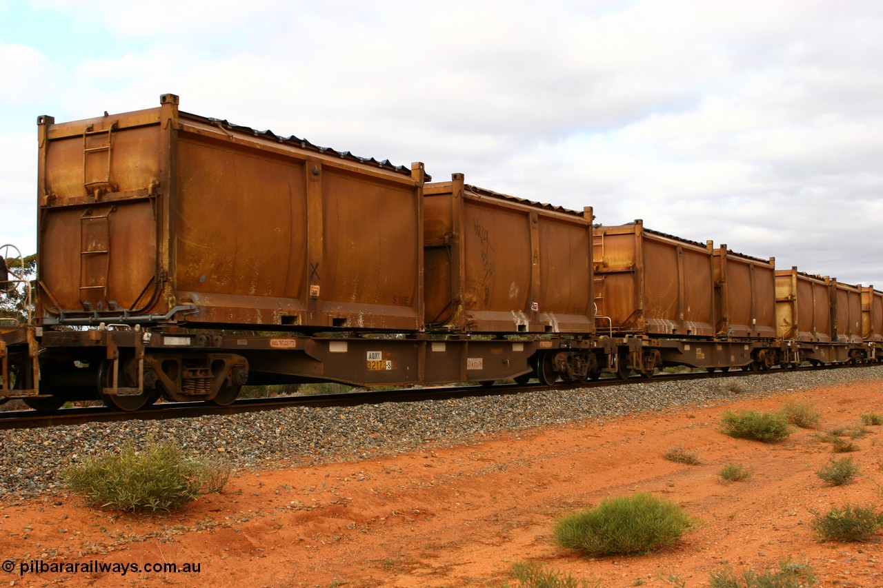 060527 4105
Scotia, AQNY 32173, one of sixty two waggons built by Goninan WA in 1998 as WQN type for Murrin Murrin container traffic, with sulphur skips S10E and S107U both with original style doors and sliding tarpaulins, train 6029 loaded Malcolm freighter.
Keywords: AQNY-type;AQNY32173;Goninan-WA;WQN-type;