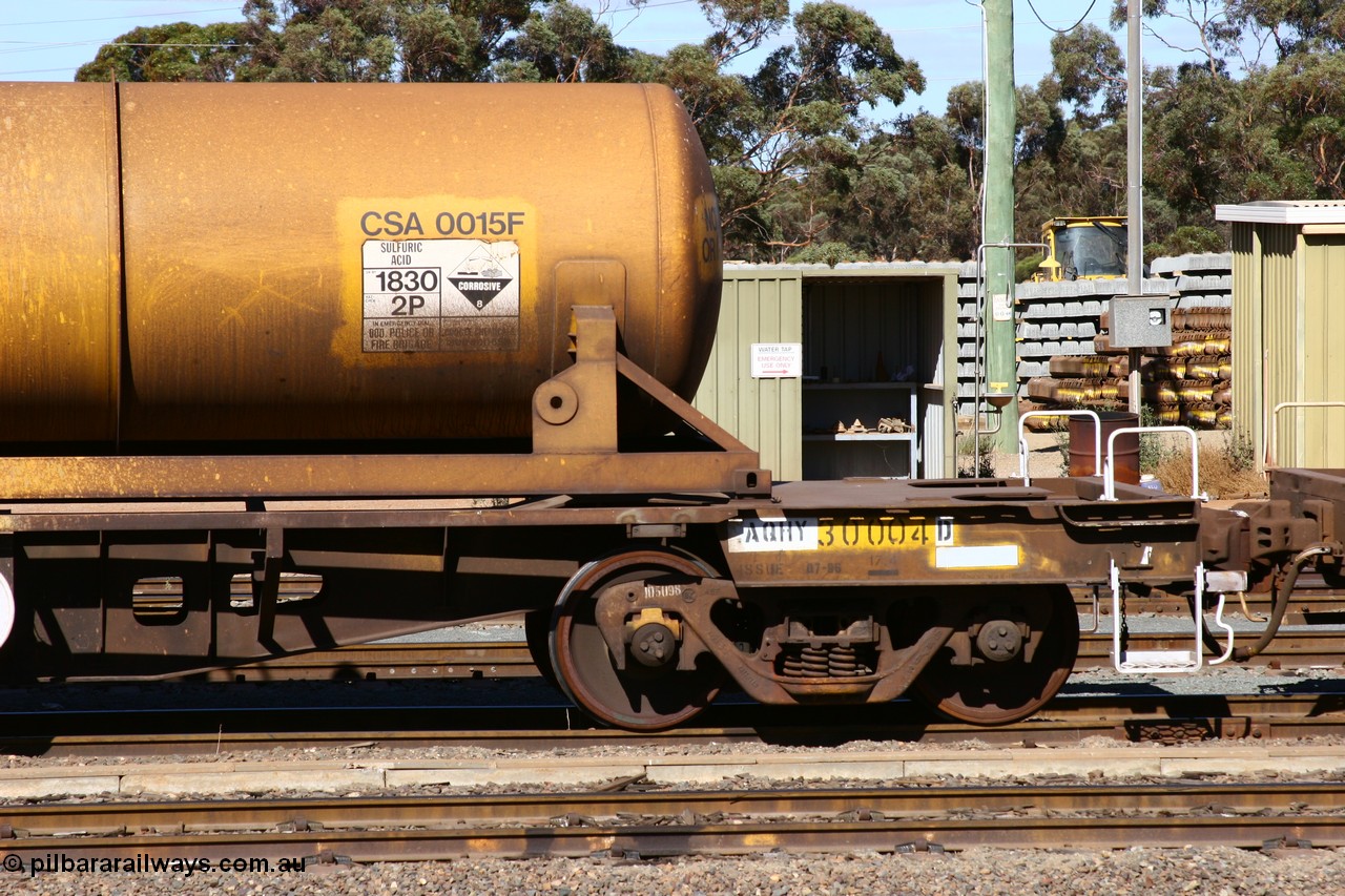 060528 4416
West Kalgoorlie, AQHY 30004 with sulphuric acid tank CSA 0015, originally built by the WAGR Midland Workshops in 1964/66 as a WF type flat waggon, then in 1997, following several recodes and modifications, was the lowest of seventy five waggons converted to the WQH type to carry CSA sulphuric acid tanks between Hampton/Kalgoorlie and Perth/Kwinana.
Keywords: AQHY-type;AQHY30004;WAGR-Midland-WS;WF-type;WFDY-type;WFDF-type;RFDF-type;WQH-type;