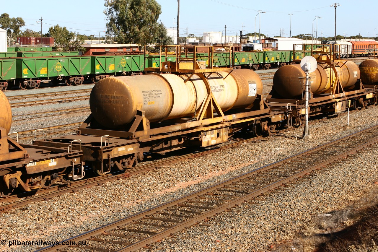 060528 4466
West Kalgoorlie, AQHY 30071 with sulphuric acid tank CSA 005, originally built by the WAGR Midland Workshops in 1964/66 as a WF type flat waggon, then in 1997, following several recodes and modifications, was one of seventy five waggons converted to the WQH type to carry CSA sulphuric acid tanks between Hampton/Kalgoorlie and Perth/Kwinana.
Keywords: AQHY-type;AQHY30071;WAGR-Midland-WS;WF-type;WFDY-type;WFDF-type;RFDF-type;WQH-type;