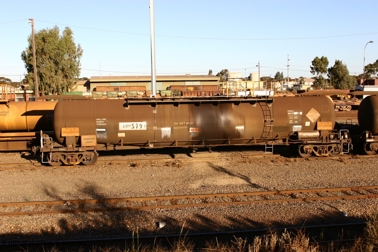 060528 4634 ATPF579J
West Kalgoorlie, ATPF 579 fuel tank waggon built by WAGR Midland Workshops 1974 for Shell as WJP type 80.66 kL one compartment one dome, fitted with type F InterLock couplers.
Keywords: ATPF-type;ATPF579;WAGR-Midland-WS;WJP-type;