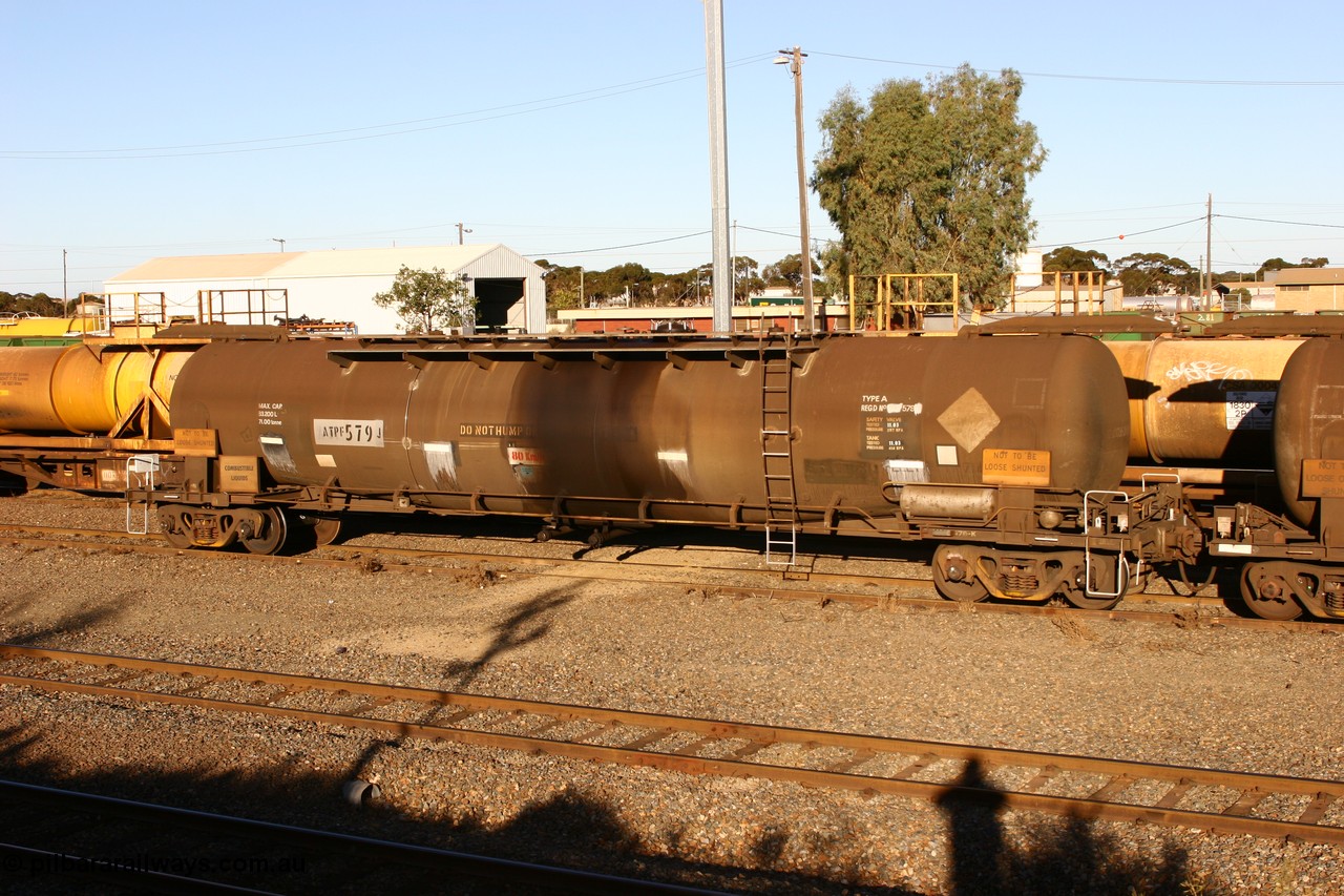 060528 4635
West Kalgoorlie, ATPF 579 fuel tank waggon built by WAGR Midland Workshops 1974 for Shell as WJP type 80.66 kL one compartment one dome, fitted with type F InterLock couplers.
Keywords: ATPF-type;ATPF579;WAGR-Midland-WS;WJP-type;