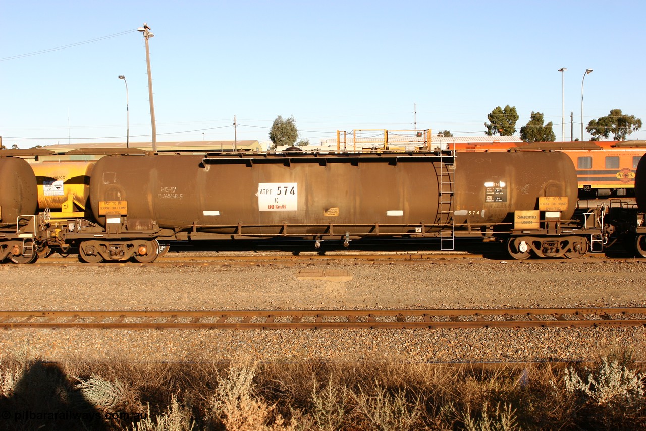 060528 4638 ATPF574K
West Kalgoorlie, ATPF 574 fuel tanker, one of nine built by WAGR Midland Workshops in 1974 for Shell as type WJP, 80.66 kL one compartment one dome, original code and fleet no. TR709, with a capacity now of 80000 litres.
Keywords: ATPF-type;ATPF574;WAGR-Midland-WS;WJP-type;