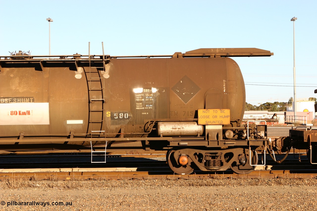 060528 4651
West Kalgoorlie, ATPF 580 fuel tank waggon built by WAGR Midland Workshops 1976 for Shell as type WJP, 80.66 kL one compartment one dome, capacity of 80500 litres, it also spent time in SA in 1985, fitted with type F InterLock couplers, Shell Fleet no. TR715 still visible.
Keywords: ATPF-type;ATPF580;WAGR-Midland-WS;WJP-type;