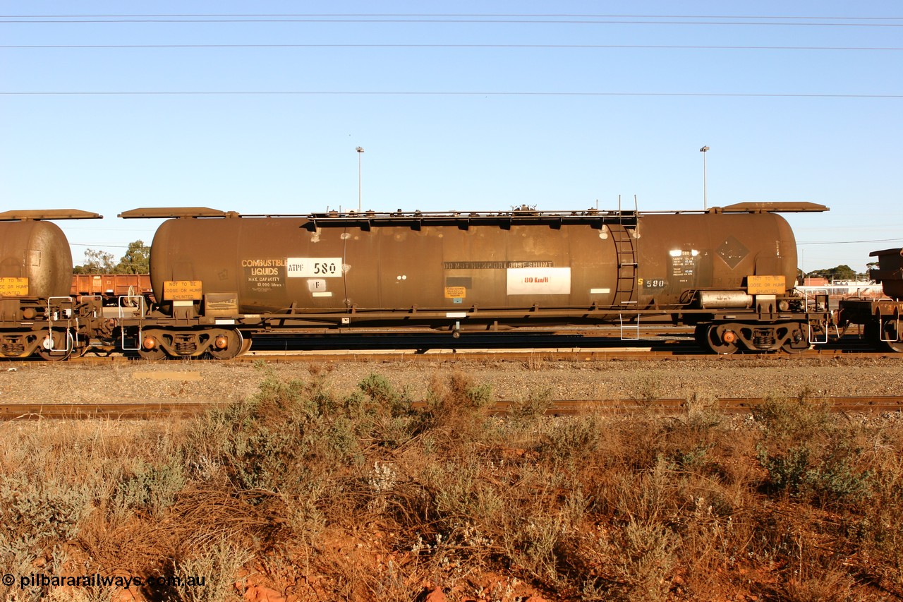 060528 4652
West Kalgoorlie, ATPF 580 fuel tank waggon built by WAGR Midland Workshops 1976 for Shell as type WJP, 80.66 kL one compartment one dome, capacity of 80500 litres, it also spent time in SA in 1985, fitted with type F InterLock couplers, Shell Fleet no. TR715 still visible.
Keywords: ATPF-type;ATPF580;WAGR-Midland-WS;WJP-type;