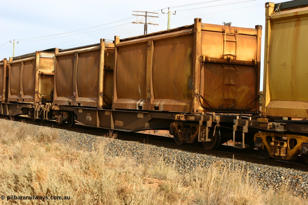 060531 4983
West Kalgoorlie, AQNY 32183 one of sixty two waggons built by Goninan WA in 1998 as WQN class for Murrin Murrin container traffic, with a pair of loaded sulphur skips with original door and sliding tarpaulins.
Keywords: AQNY-type;AQNY32183;Goninan-WA;WQN-type;