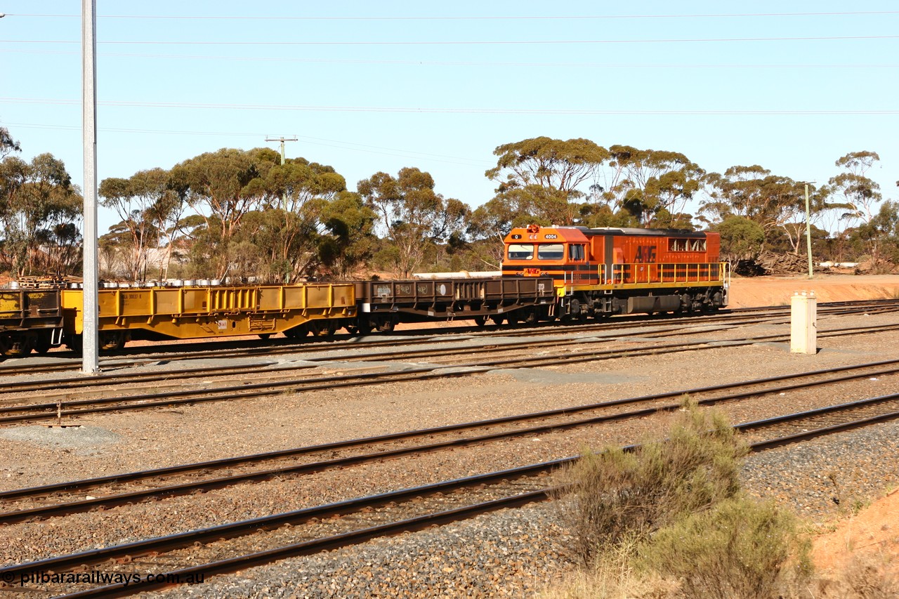 070529 9327
West Kalgoorlie, WGLA 30027 originally built by WAGR Midland Workshops in 1965 as WF type bogie flat waggon, to WFW in 1974, then converted to bagged nickel matte traffic WGLA type in 1984 and WGL 632 originally one of three units built by Westrail Midland Workshops in 1976-7 as WGL type bogie flat waggon for Western Mining Corporation for bagged nickel matte traffic.
Keywords: WGLA-type;WGLA30027;WAGR-Midland-WS;WF-type;WFW-type;WFDY-type;