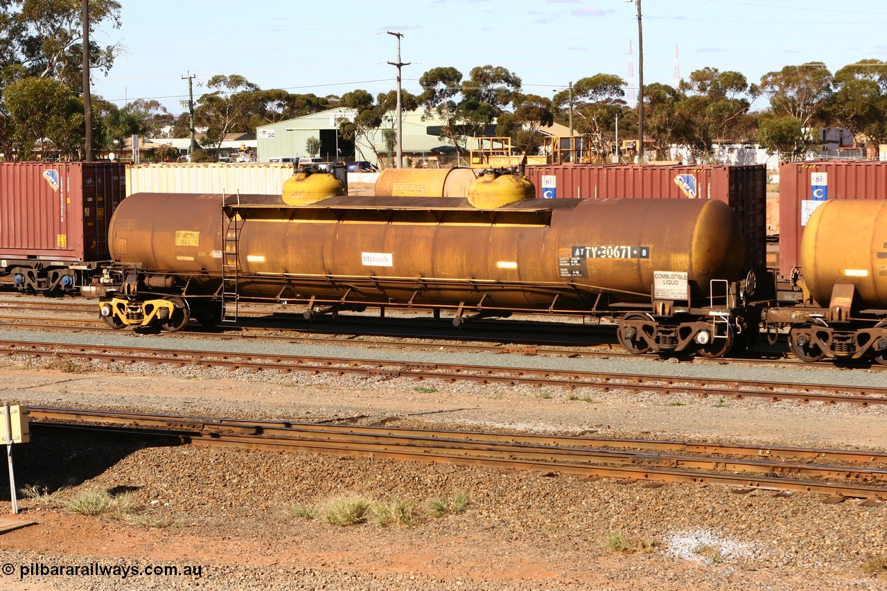 070529 9412
West Kalgoorlie, ATTY 30671 fuel tanker, class leader of five built by AE Goodwin NSW in 1970 as WST class, recoded to WSTY and then ATTY. 78600 litre capacity.
Keywords: ATTY-type;ATTY30671;AE-Goodwin;WST-type;WSTY-type;