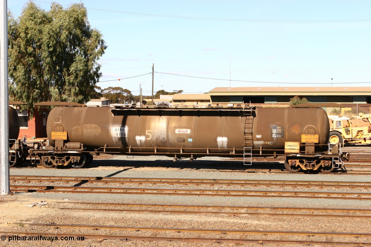 070529 9421
West Kalgoorlie, ATPF 578 fuel tank waggon, originally built by WAGR Midland Workshops in 1974 for Shell as type WJP, it also spent time in SA in 1985, 80.66 kL one compartment one dome, capacity of 80350 litres, fitted with type F InterLock couplers.
Keywords: ATPF-type;ATPF578;WAGR-Midland-WS;WJP-type;