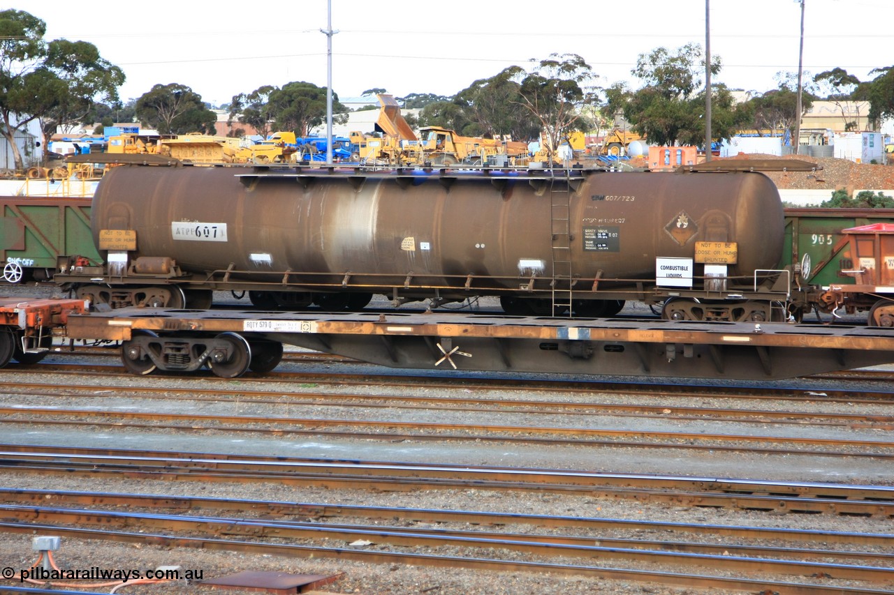 100601 8426
West Kalgoorlie, ATPF 607 fuel tank waggon, built by Westrail Midland Workshops 1982 for Shell as WJP type, 80.66 kL one compartment one dome, fitted with type F InterLock couplers.
Keywords: ATPF-type;ATPF607;Westrail-Midland-WS;WJP-type;