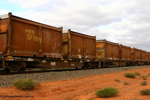 060527 4110
Scotia, AQNY 32179, one of sixty two waggons built by Goninan WA in 1998 as WQN type for Murrin Murrin container traffic, with sulphur skips S38A and S73K with original doors and modified top tarpaulins, S38A also stencilled 'OPEN BY HAND', train 6029 loaded Malcolm freighter.
Keywords: AQNY-type;AQNY32179;Goninan-WA;WQN-type;