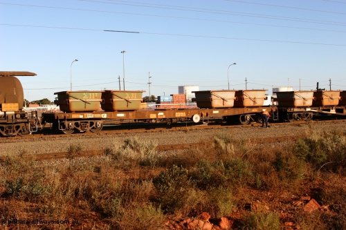 060528 4653
West Kalgoorlie, AFBF 33069 loaded with nickel kibbles as the examiner tends to the bogie brakes, originally built by WAGR Midland Workshops as WGX type in 1967, re-coded to WGS for superphosphate traffic in 1970, in 1979 to WOAX, then in 1987 converted to WOSF for steel traffic.
Keywords: AFBF-type;AFBF33069;WAGR-Midland-WS;WGX-type;WGS-type;WOAX-type;WOSF-type