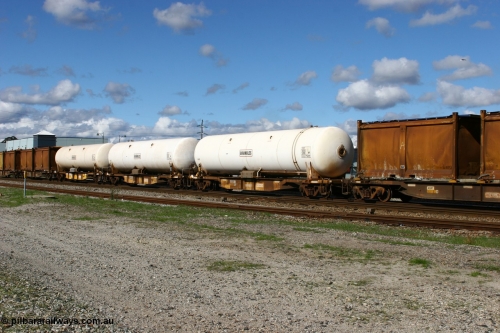 060602 5165
Midland, AZKY type anhydrous ammonia tank waggons, three of twelve built by Goninan WA in 1998 as type WQK for Murrin Murrin traffic, fitted with Brambles anhydrous ammonia tanks.
Keywords: AZKY-type;Goninan-WA;WQK-type;