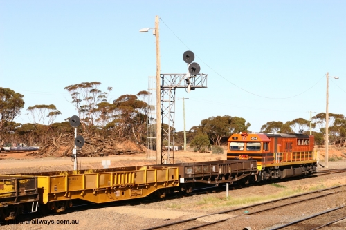 070529 9329
West Kalgoorlie, WGLA 30027 originally built by WAGR Midland Workshops in 1965 as WF type bogie flat waggon, to WFW in 1974, then converted to bagged nickel matte traffic WGLA type in 1984 and WGL 632 originally one of three units built by Westrail Midland Workshops in 1976-7 as WGL type bogie flat waggon for Western Mining Corporation for bagged nickel matte traffic.
Keywords: WGLA-type;WGLA30027;WAGR-Midland-WS;WF-type;WFW-type;WFDY-type;