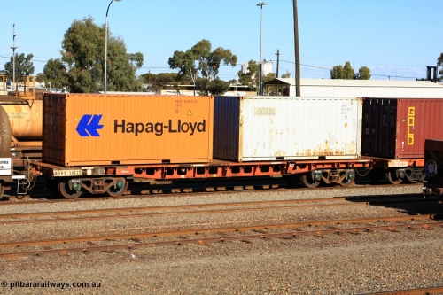 100602 8676
West Kalgoorlie, AQRY 1012, part of a bar coupled pair, ex AFRF type two-pack rail transport waggon, last used on the Darwin line. Loaded with two 20' 22G1 type containers, Hapag-Lloyd HLXU 346611 and Gateway GATU 076734.
Keywords: AQRY-type;AQRY1012;AFRF-type;