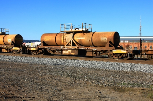 100609 09944
Midland, AQHY 30099 with sulphuric acid tank CSA 0057, originally built by the WAGR Midland Workshops in 1964/66 as a WF type flat waggon, then in 1997, following several recodes and modifications, was one of seventy five waggons converted to the WQH to carry CSA sulphuric acid tanks between Hampton/Kalgoorlie and Perth/Kwinana.
Keywords: AQHY-type;AQHY30099;WAGR-Midland-WS;WF-type;WFDY-type;WFDF-type;RFDF-type;WQH-type;