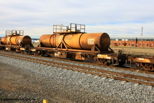 100611 0335
Midland, AQHY 30026 with sulphuric acid tank CSA 0058, originally built by the WAGR Midland Workshops in 1964/66 at WF type flat waggons, then following several codes and modifications in 1997 seventy five were converted to WQH to carry CSA sulphuric acid tanks between Hampton/Kalgoorlie and Perth/Kwinana.
Keywords: AQHY-type;AQHY30026;WAGR-Midland-WS;WF-type;WFW-type;WFDY-type;WFDF-type;RFDF-type;WQH-type;