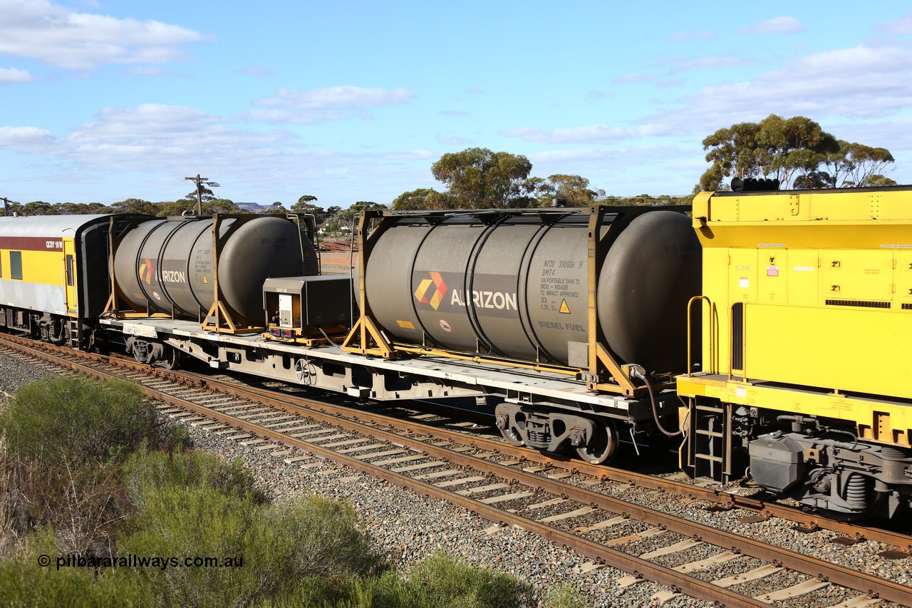 160525 4861
West Kalgoorlie, Aurizon intermodal train 2MP1. Inline fuelling waggon QQFY 4271, originally built for Commonwealth Railways in 1976 by Perry Engineering SA as type RMX, recoded to AQMX, 70 tonne bogies became AQMY, then RQMY, to QR National in 2007. Seen here with two 30' diesel fuel tanktainers from Nantong Tank Container Company, NTTU 330006 and NTTU 330001 each with a 30800 litre capacity, and fuel transfer or pump unit QRIP 06.
Keywords: QQFY-type;QQFY4271;Perry-Engineering-SA;RMX-type;AQMX-type;AQMY-type;RQMY-type;