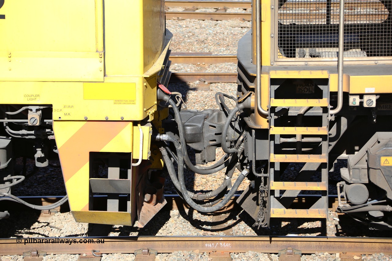 160525 4937
West Kalgoorlie, Aurizon intermodal train 2MP1, coupling between locomotives, shows the MU or Multiple Unit cable going into the socket with the red cap, below that with the crimp fitting is the in-line fuel hose between locomotives. Then you also have the train brake pipe and loco control lines and of course the couplers.
