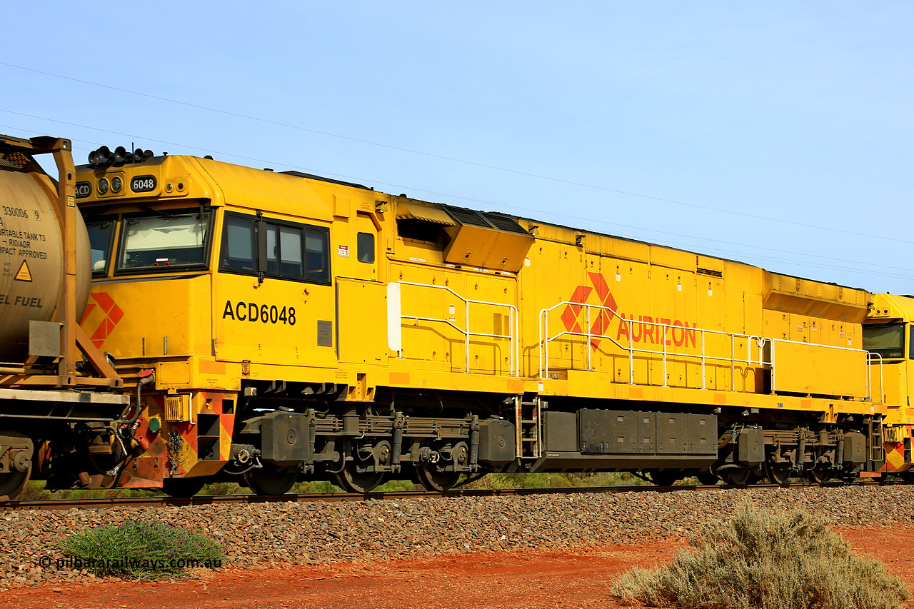 231020 8142
Parkeston, ACD class locomotive ACD 6048 built by Goninan NSW as a GE C44ACi model in April 2022, trails on 4UP1 along the mainline at Parkeston enroute to Kwinana, 20th of October 2023.
Keywords: ACD-class;ACD6048;Goninan-NSW;GE;C44ACi;