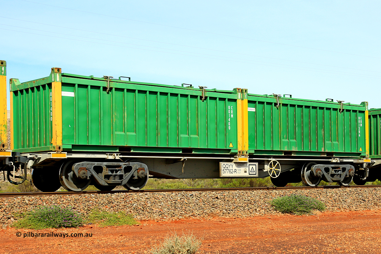 231020 8208
Parkeston, QQYY type 40' container waggon QQYY 57762 one of five hundred ordered by Aurizon and built by CRRC Yangtze Group of China in 2022. In service with two loaded 20' half height hard top 'rotainers' lettered CRM, for Cristal Mining before they were absorbed into Tronox, CRM 001306 with Tronox decal and yellow corner posts and CRM 001400 with Cristal decal and yellow corner posts, on Aurizon's Tronox mineral sands train 4UP1 from Ivanhoe / Broken Hill (NSW) to Kwinana (WA). 20th of October 2023.
Keywords: QQYY-type;QQYY57762;CRRC-Yangtze-Group-China;