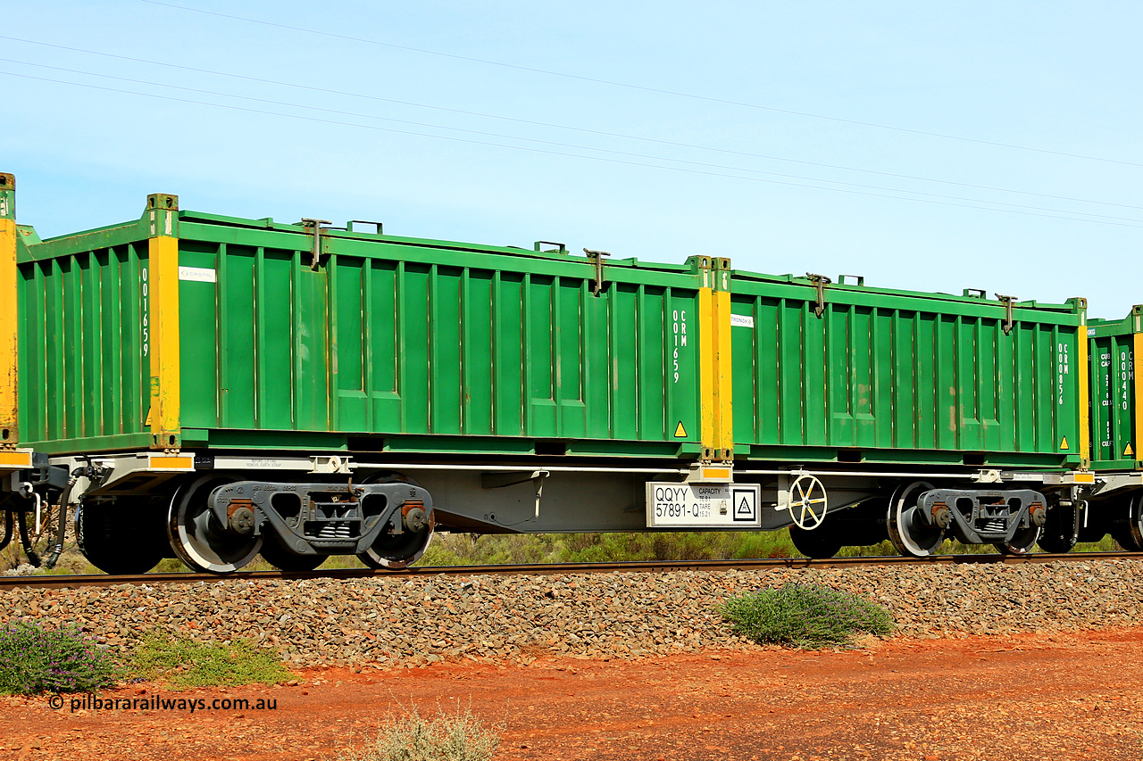 231020 8227
Parkeston, QQYY type 40' container waggon QQYY 57891 one of five hundred ordered by Aurizon and built by CRRC Yangtze Group of China in 2022. In service with two loaded 20' half height hard top 'rotainers' lettered CRM, for Cristal Mining before they were absorbed into Tronox, CRM 000856 with Tronox decal and yellow corner posts and CRM 001659 with Cristal decal and yellow corner posts, on Aurizon's Tronox mineral sands train 4UP1 from Ivanhoe / Broken Hill (NSW) to Kwinana (WA). 20th of October 2023.
Keywords: QQYY-type;QQYY57891;CRRC-Yangtze-Group-China;