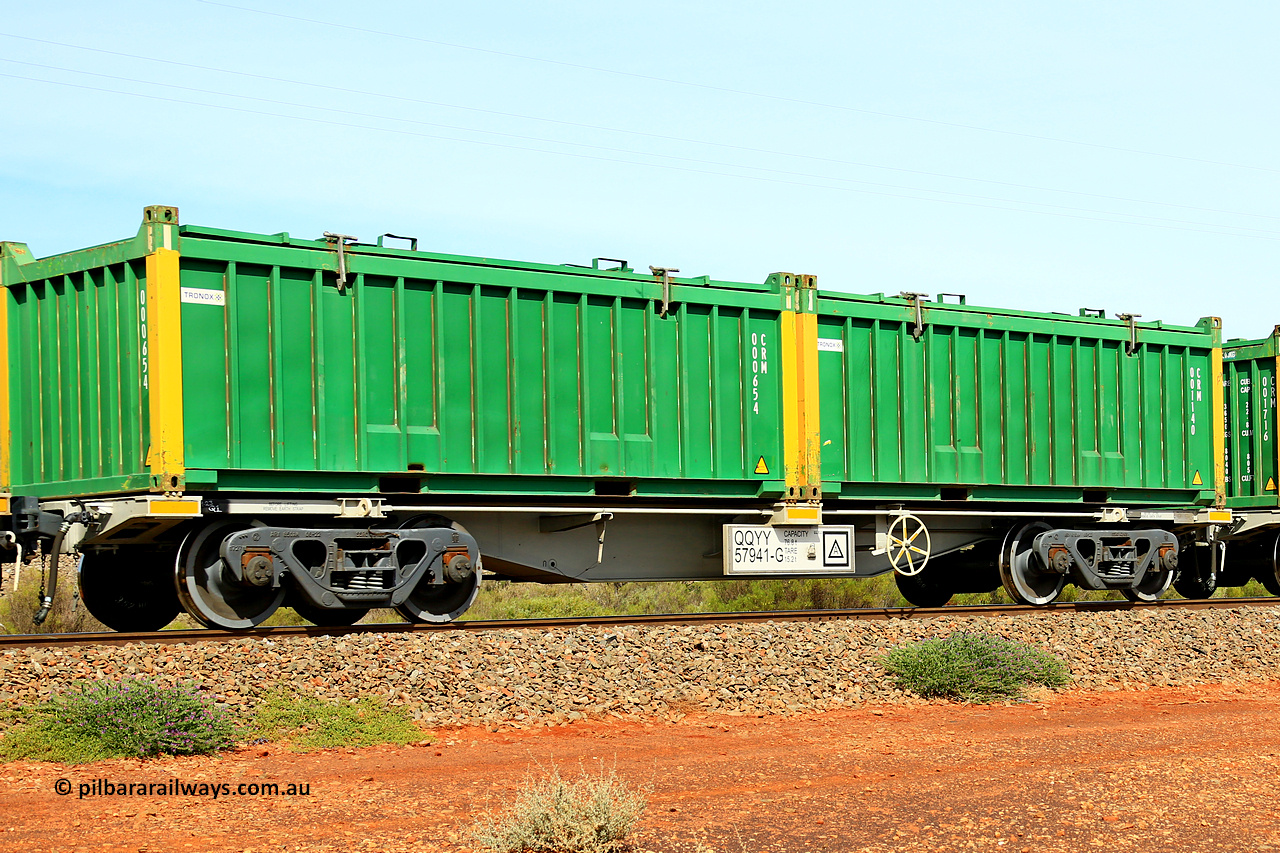 231020 8231
Parkeston, QQYY type 40' container waggon QQYY 57941 one of five hundred ordered by Aurizon and built by CRRC Yangtze Group of China in 2022. In service with two loaded 20' half height hard top 'rotainers' lettered CRM, for Cristal Mining before they were absorbed into Tronox, CRM 001140 with Tronox decal and yellow corner posts and CRM 000654 with Tronox decal and yellow corner posts, on Aurizon's Tronox mineral sands train 4UP1 from Ivanhoe / Broken Hill (NSW) to Kwinana (WA). 20th of October 2023.
Keywords: QQYY-type;QQYY57941;CRRC-Yangtze-Group-China;