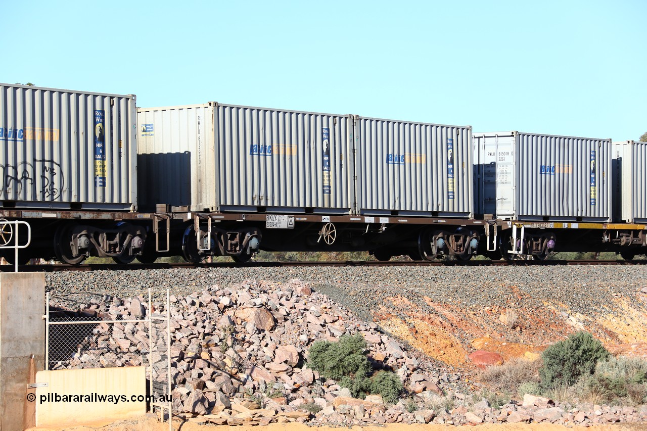 160522 2059
Binduli, 5MP2 steel train, RKLY 20304 container waggon, originally built by EPT NSW in 1979-81 as an BDY / NODY open waggon before being heavily modified by ANI Engineering in 1998, loaded with a pair of 20' 22G1 type Royal Wolf containers with Pacific National decals, RWLU 814970 and RWLU 814877.
Keywords: RKLY-type;RKLY20304;EPT-NSW;BDY-type;NODY-type;