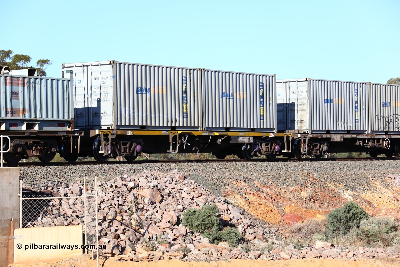 160522 2061
Binduli, 5MP2 steel train, NQYY 20897 container waggon, originally built by EPT NSW in 1980-81 as an BDY / NODY open waggon before being heavily modified with a pair of Royal Wolf 20' 22G1 type containers with Pacific National decals, RWLU 815065 and RWLU 815037.
Keywords: NQYY-type;NQYY20897;EPT-NSW;BDY-type;NODY-type;