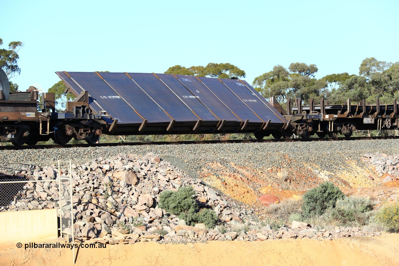 160522 2068
Binduli, 5MP2 steel train, RKVY 8002 wide steel plate tilt waggon, built as part of a batch of five units by Goninan Bassendean WA in 2011, loaded with plates.
Keywords: RKVY-type;RKVY8002;Goninan-WA;