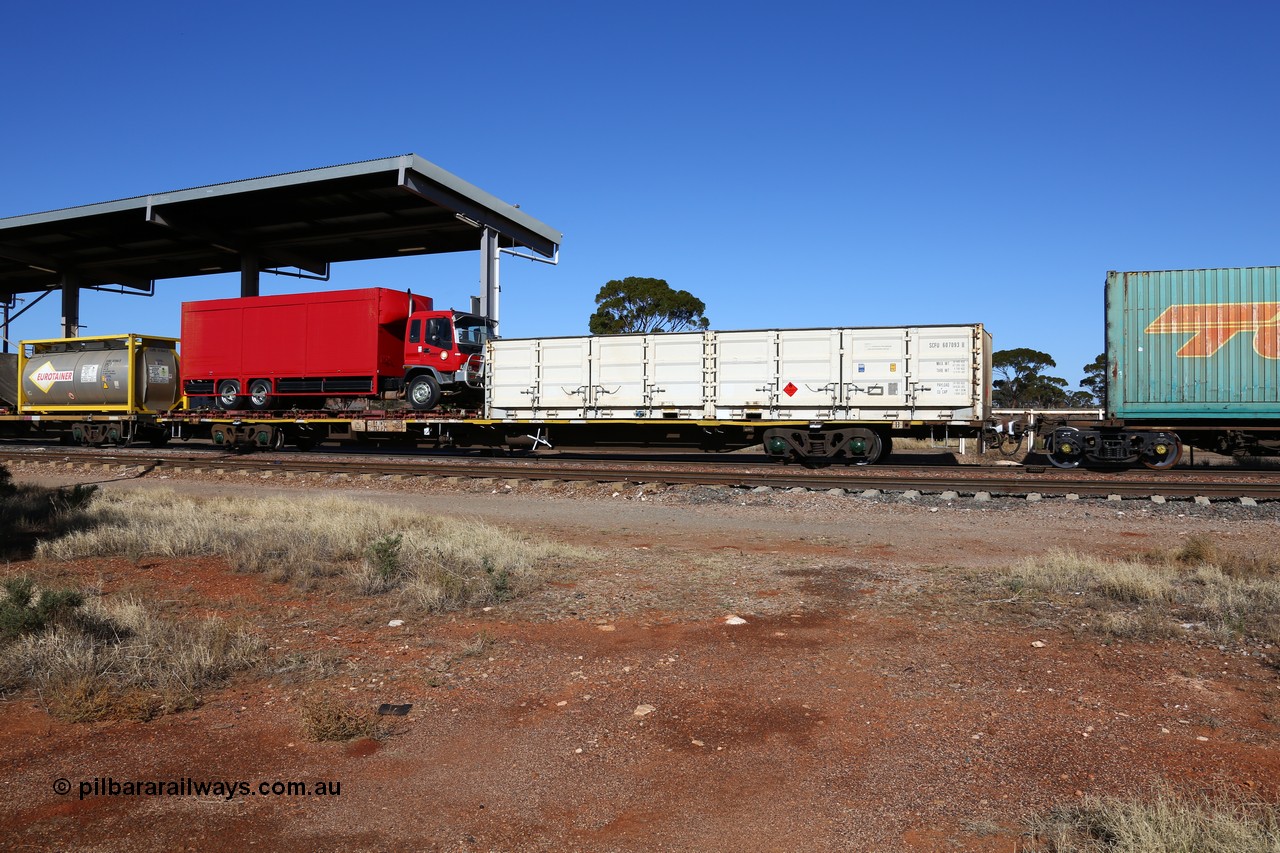 160522 2126
Parkeston, 6MP4 intermodal train, RQJW type container waggon RQJW 21964 built by Mittagong Engineering NSW as part of a batch of twenty five NQJW type waggons in 1981, loaded with half height side door SCF container SCFU 607093 and a flatrack with a Regal Transport truck.
Keywords: RQJW-type;RQJW21964;Mittagong-Engineering-NSW;NQJW-type;
