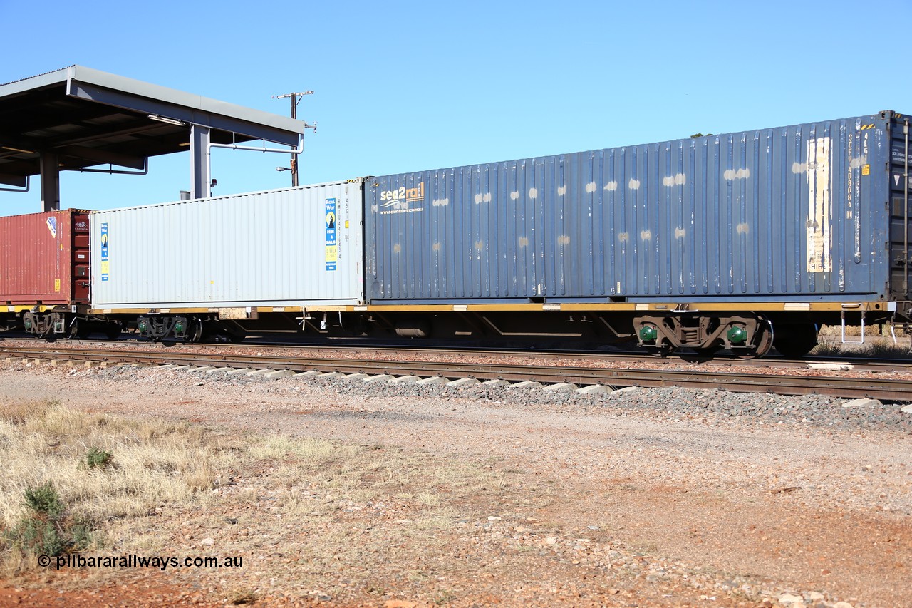160522 2153
Parkeston, 6MP4 intermodal train, RQJW 60007 container waggon, one of fifty built by EPT NSW as NQJW type in 1984-85, with a pair of 40' containers, SCF sea2rail SCFU 408084 and Royal Wolf RWTU 441643.
Keywords: RQJW-type;RQJW60007;EPT-NSW;NQJW-type;