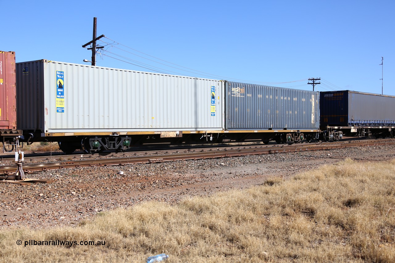 160522 2154
Parkeston, 6MP4 intermodal train, RQJW 60007 container waggon, one of fifty built by EPT NSW as NQJW type in 1984-85, with a pair of 40' containers, SCF sea2rail SCFU 408084 and Royal Wolf RWTU 441643.
Keywords: RQJW-type;RQJW60007;EPT-NSW;NQJW-type;