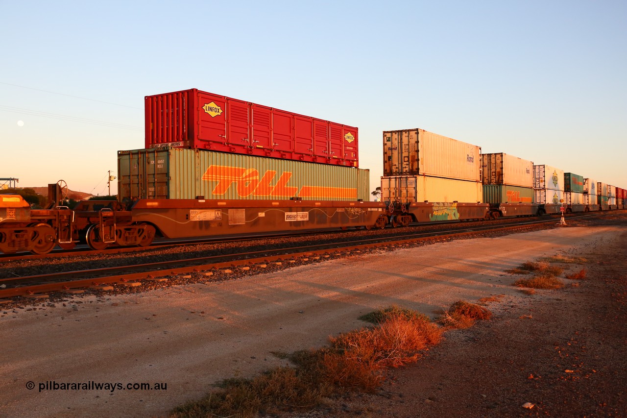 160523 2729
Parkeston, 1PM5 intermodal train, RRRY 7001 type leader of nineteen 5-pack well waggon sets built in China at Zhuzhou Rolling Stock Works for Goninan in 2005 with a variety of containers double stacked.
Keywords: RRRY-type;RRRY7001;CSR-Zhuzhou-Rolling-Stock-Works-China;