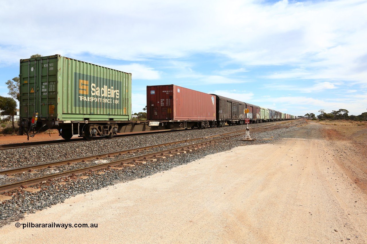 160523 3045
Parkeston, 7SP3 intermodal train, view looking from the rear with RQJW 22081 container waggon, one of fifty built in 1975-76 by Mittagong Engineering NSW as JCW type, recoded to NQJW loaded with a CPC 40' 4EG1 type box WPWU 098921 and Sadleirs 20' 2EB0 type box RCSB 5072 and then the RLUY and RSLY louvre vans.
Keywords: RQJW-type;RQJW22081;Mittagong-Engineering-NSW;JCW-type;NQJW-type;