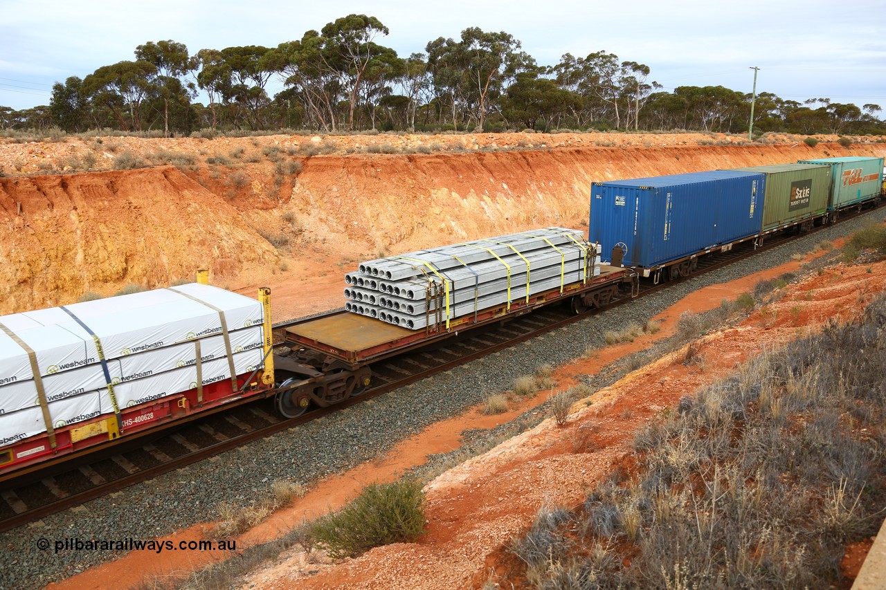 160524 3786
West Kalgoorlie, 2PM6 intermodal train, RRGY 7144 platform 5 of 5-pack articulated skeletal waggon set, one of fifty originally built by AN Rail Islington Workshops in 1996-97 as type RRBY, later rebuilt with 48' intermediate decks and recoded to RRGY, 40' KT flatrack KT 19.
Keywords: RRGY-type;RRGY7144;AN-Islington-WS;RRBY-type;