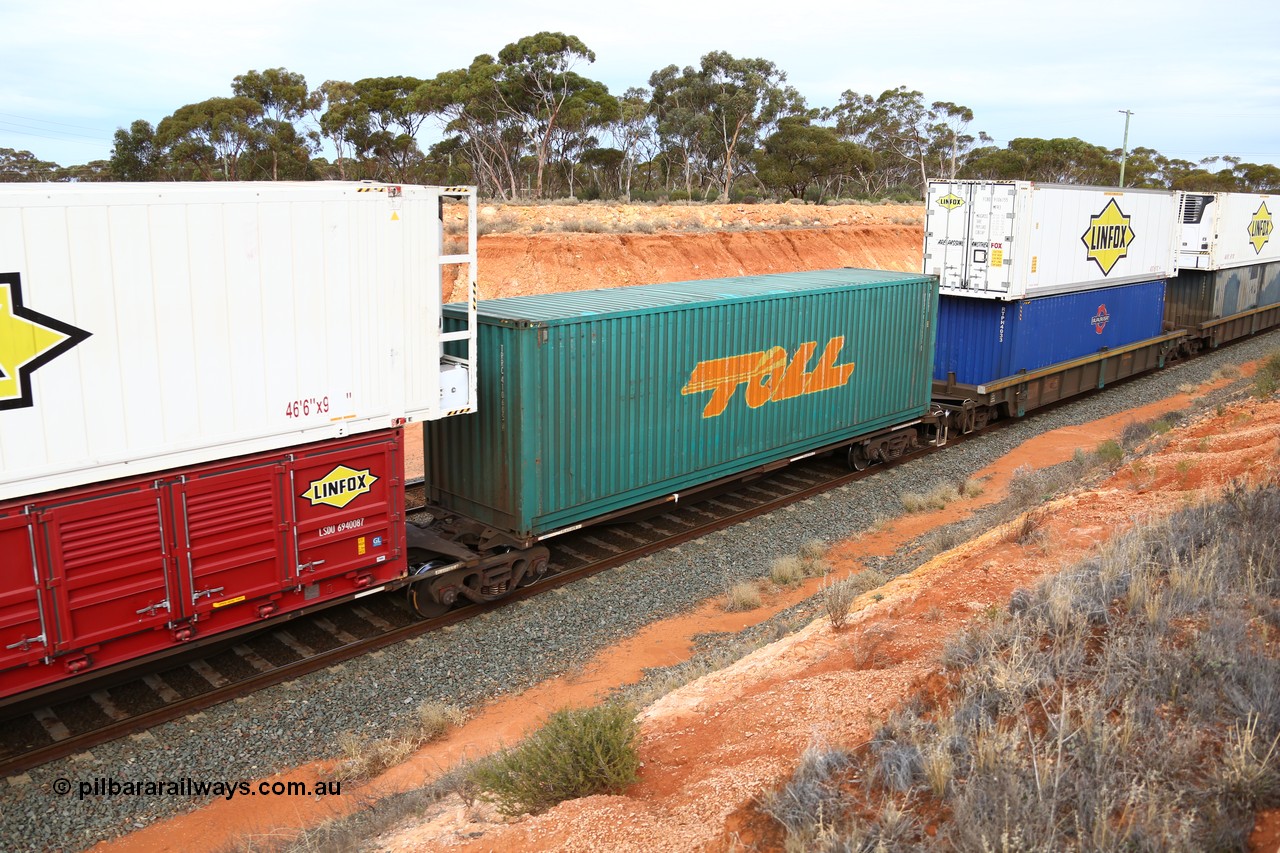 160524 3799
West Kalgoorlie, 2PM6 intermodal train, RRGY 7125 platform 3 of 5-pack articulated skeletal waggon set, one of fifty originally built by AN Rail Islington Workshops in 1996-97 as type RRBY, later rebuilt with 48' intermediate decks and recoded to RRGY, with a Toll 40' 4FG1 type box TRRC 410605 [2].
Keywords: RRGY-type;RRGY7125;AN-Islington-WS;RRBY-type;