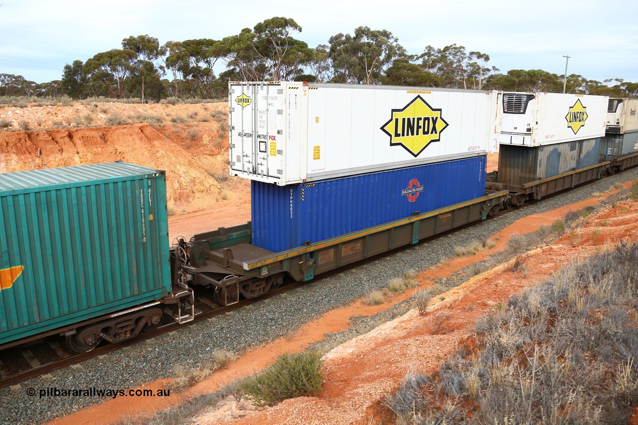 160524 3800
West Kalgoorlie, 2PM6 intermodal train, RRXY 8 platform 5 of 5-pack well waggon set, one of eleven built by Bradken Qld in 2002 for Toll from a Williams-Worley design with a 40' Railroad Transport box RTPH 4033 in the well and a Linfox 46' MFR3 type reefer FCBD 910615 on top.
Keywords: RRXY-type;RRXY8;Williams-Worley;Bradken-Rail-Qld;