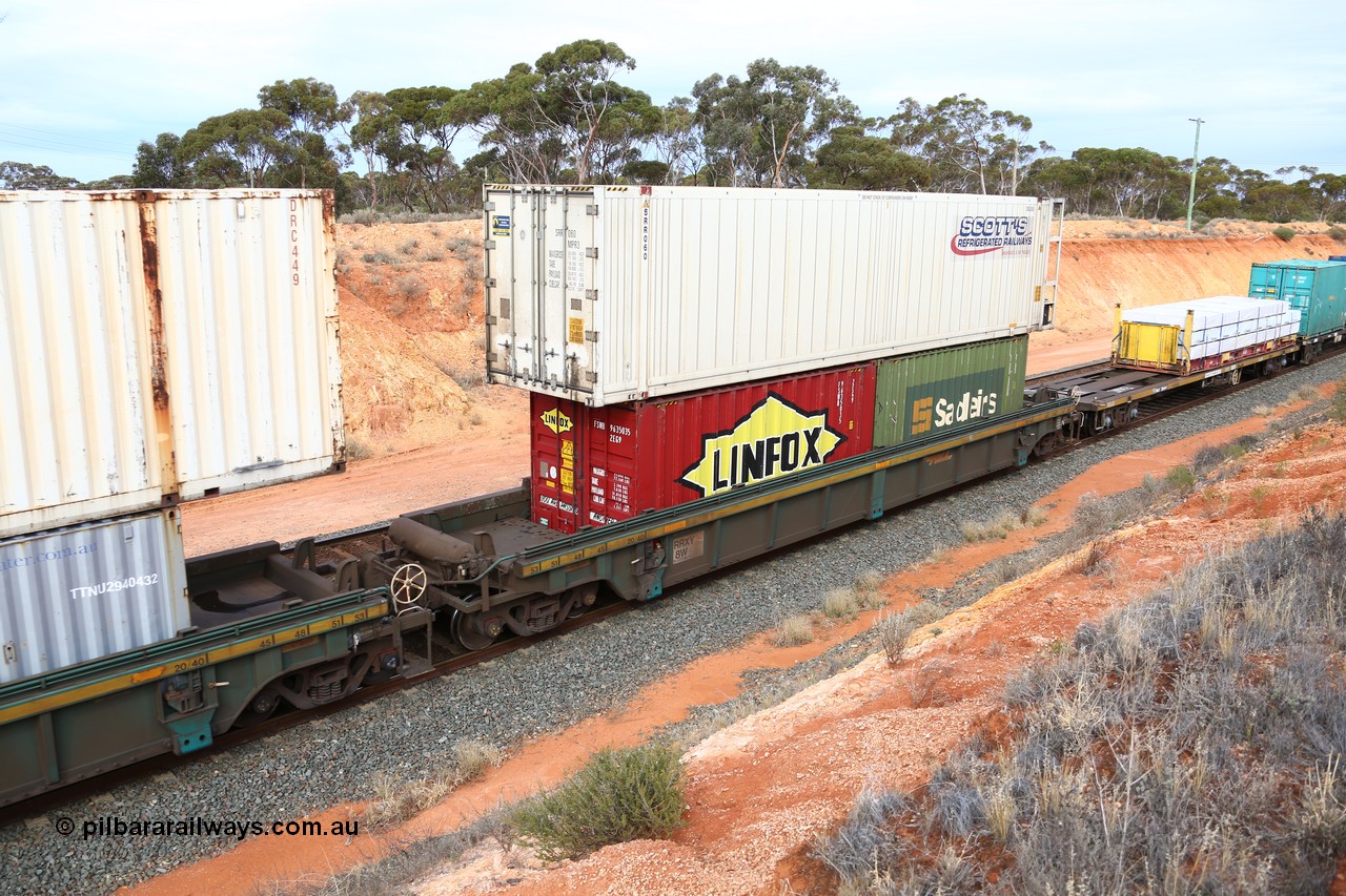 160524 3804
West Kalgoorlie, 2PM6 intermodal train, RRXY 8 platform 1 of 5-pack well waggon set, one of eleven built by Bradken Qld in 2002 for Toll from a Worley-Williams design with 20' Linfox 2EG9 type FSWB 963503 and a Sadleirs 2EB0 type box RCS? 6063? in the well and Scott's Refrigerated Railways 46' MPR3 type reefer SRR 060 on top.
Keywords: RRXY-type;RRXY8;Worley-Williams;Bradken-Rail-Qld;