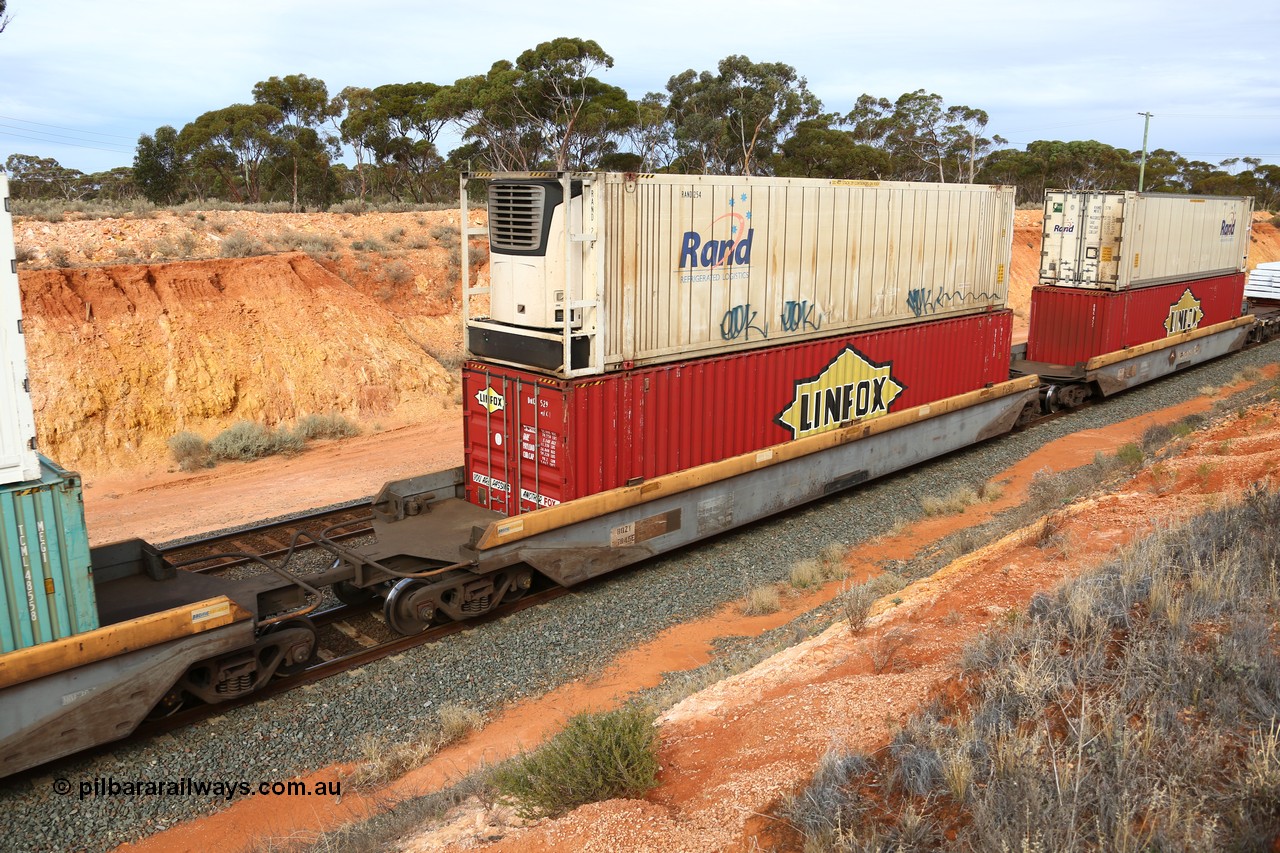 160524 3815
West Kalgoorlie, 2PM6 intermodal train, RQZY 7045 platform 2 of 5-pack well waggon set, one of thirty two sets built by Goninan NSW in 1995-96 for National Rail loaded with Linfox 48' MFG1 container DRC 529 double stacked with RAND Refrigerated Logistics 46' MFR1 type reefer RAND 254.
Keywords: RQZY-type;RQZY7045;Goninan-NSW;