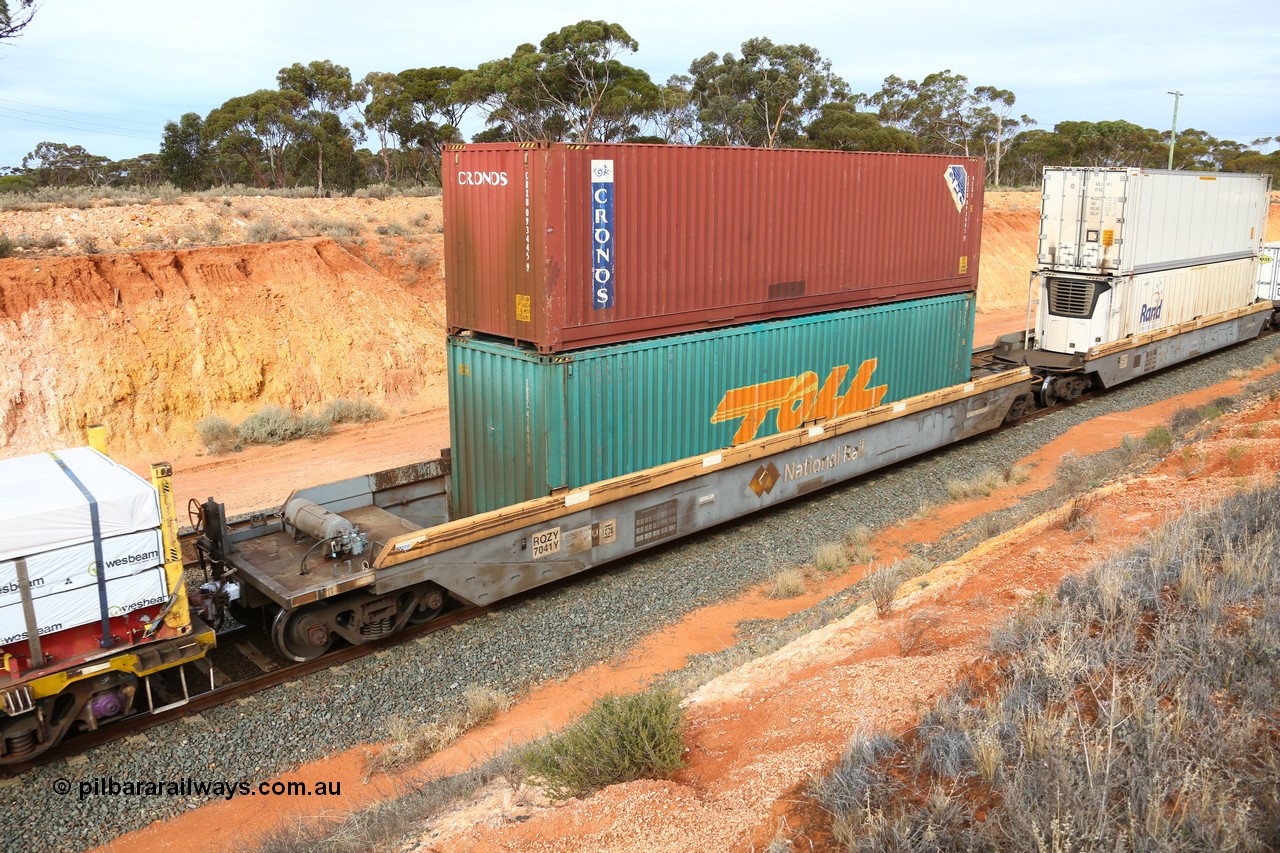 160524 3819
West Kalgoorlie, 2PM6 intermodal train, RQZY 7041 platform 5 of 5-pack well waggon set, one of thirty two sets built by Goninan NSW in 1995-96 for National Rail loaded with a Toll 40' 4FG1 type container TRRC 410624 [4] double stacked with Cronos 40' 4EG1 type container CRXU 093445 [9].
Keywords: RQZY-type;RQZY7041;Goninan-NSW;