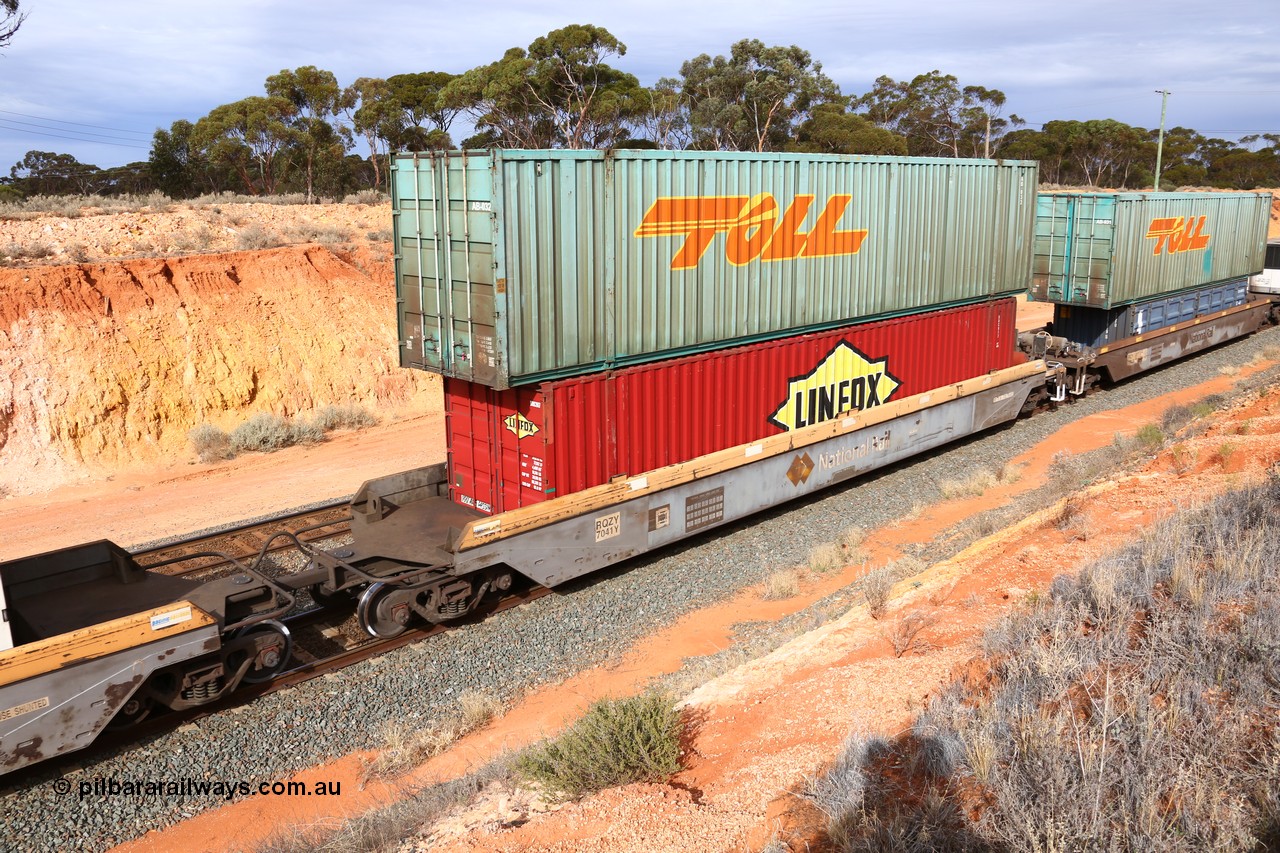 160524 3823
West Kalgoorlie, 2PM6 intermodal train, RQZY 7041 platform 1 of 5-pack well waggon set, one of thirty two sets built by Goninan NSW in 1995-96 for National Rail loaded with a Linfox 48' container DRC 917 double stacked with a Toll 53' car container AB 032.
Keywords: RQZY-type;RQZY7041;Goninan-NSW;