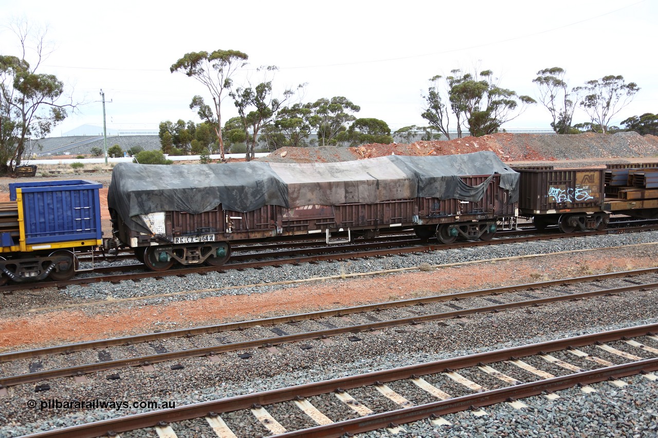 160524 4312
West Kalgoorlie, 1MP2 steel train, RKCX type open waggon RKCX 64, originally built by Victorian Railways Newport Workshops as ELF type open waggon in 1963, later recoded to ELX. Recoded to VOCX in 1978, VOFX in 1978, 1994 to ROBX then 1995 for current code. V/LINE name still visible under Pacific National tarp.
Keywords: RKCX-type;RKCX64;Victorian-Railways-Newport-WS;ELX-type;VOCX-type;VOFX-type;ROBX-type;